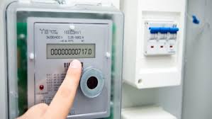 Person checking electricity usage on a smart meter app in Rawalpindi.