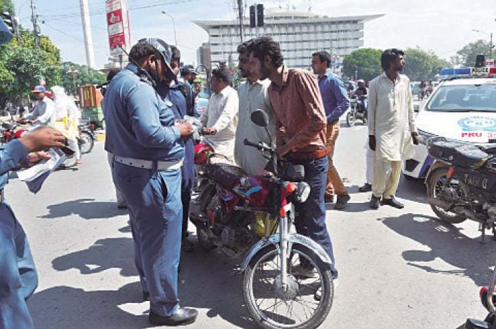 Motorcyclist in Sargodha under e-challan surveillance.