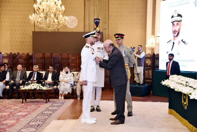 Handshake during medal award at Aiwan-e-Sadr, September 2025.