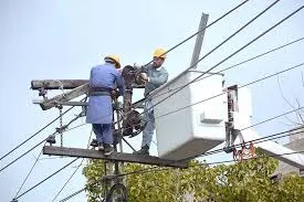 Workers maintaining power lines in Pakistan