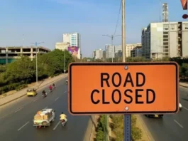 Jahangir Road closure in Karachi with construction barriers and traffic diversion signs